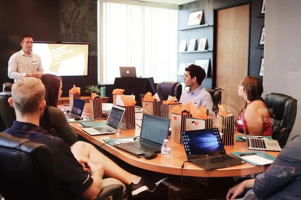 A team in an office discussing enterprise search during a meeting