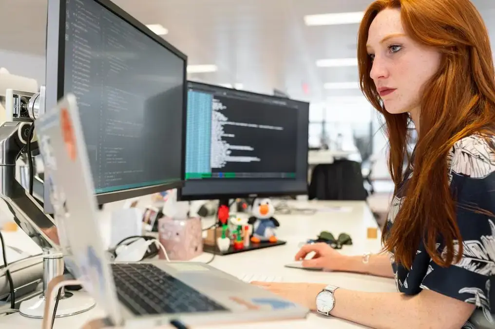 A woman in an office researching enterprise search on her computer